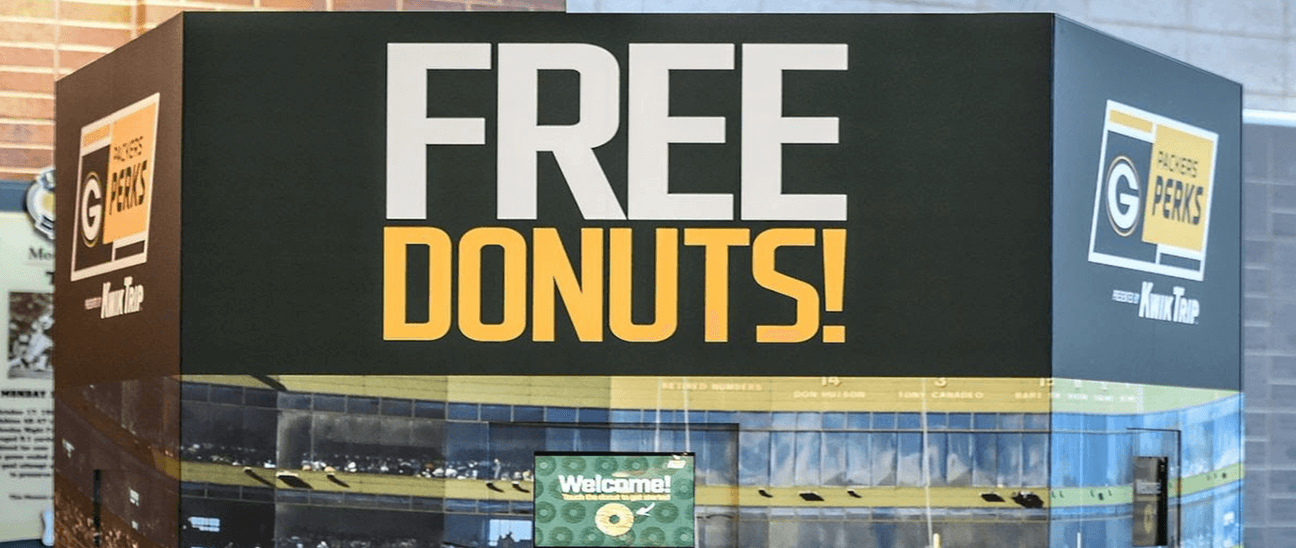 If the machines ever do rise up at some point in the future and wrest control of Earth from us humans, they'll be wise to take a cue from their compatriots currently toiling at Lambeau Field and give away free donuts.